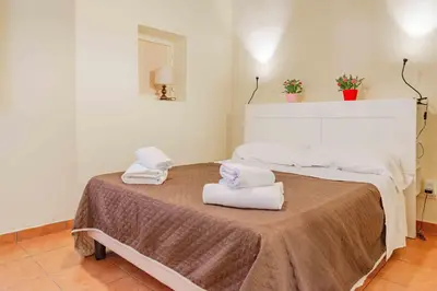 Letto o letti in una camera di Corte Passi Florence