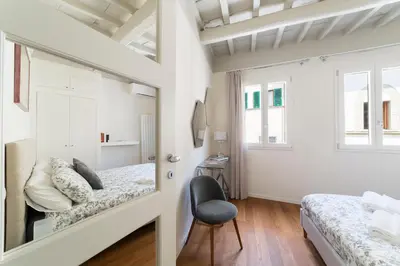 Letto o letti in una camera di San Niccolò hidden gem suite
