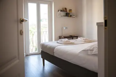 Letto o letti in una camera di Pietrapiana34 Boutique Apartments