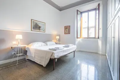 Letto o letti in una camera di Santa Maria Novella 4 bedrooms by Mmega