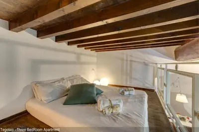 Letto o letti in una camera di Tegolaio Apartments by Mamo Florence