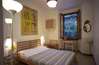 Letto o letti in una camera di B&B l'Olivo