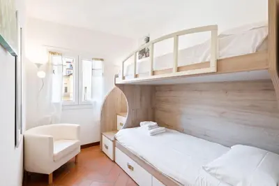 Letto o letti in una camera di GuestHost - Palazzo Medici Apartments