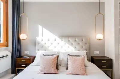 Letto o letti in una camera di GuestHost - Cozy Gem in Santa Croce