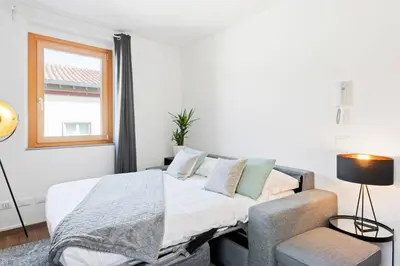 Letto o letti in una camera di GuestHost - Cozy Gem in Santa Croce