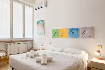 Letto o letti in una camera di GuestHost - Piazza Oberdan Patio Apartment