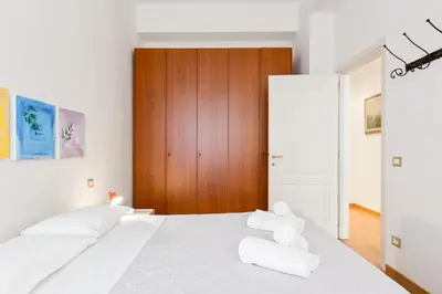 Letto o letti in una camera di GuestHost - Piazza Oberdan Patio Apartment