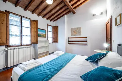 Letto o letti in una camera di Roommo Oltrarno