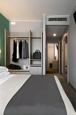 Letto o letti in una camera di Hotel Raffaello