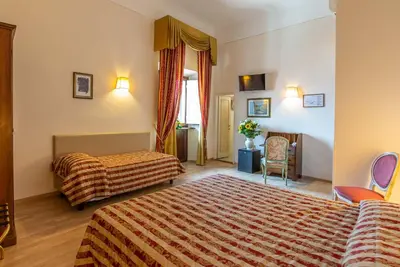 Letto o letti in una camera di Hotel Paris
