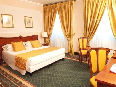 Letto o letti in una camera di Hotel Berchielli