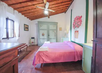 Letto o letti in una camera di Winery Houses in Chianti