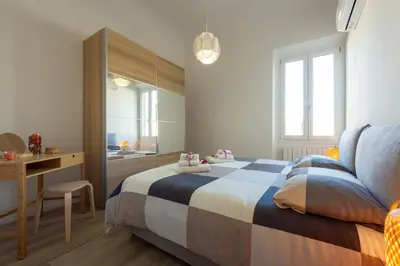 Letto o letti in una camera di Mosse Leopolda Apartment by Mamo Florence