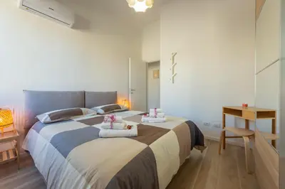 Letto o letti in una camera di Mosse Leopolda Apartment by Mamo Florence