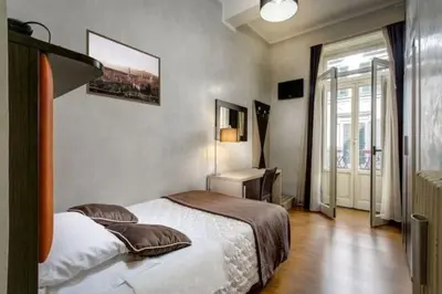 Letto o letti in una camera di The One Firenze