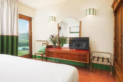 Letto o letti in una camera di Relais Poggio Borgoni