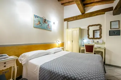 Letto o letti in una camera di Hotel Collodi Firenze