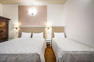 Letto o letti in una camera di Hotel Alessandra
