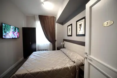Letto o letti in una camera di FLORENCE ROOMS67