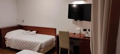 Letto o letti in una camera di Hotel La Villetta