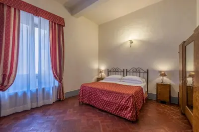 Letto o letti in una camera di B&B Home in Florence