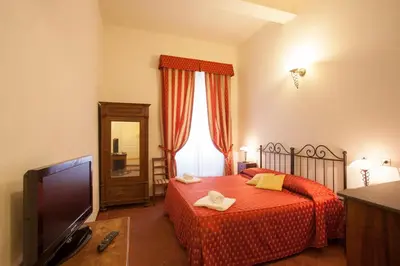 Letto o letti in una camera di B&B Home in Florence