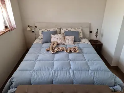 Letto o letti in una camera di Podere I Ripidi