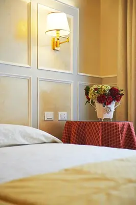 Letto o letti in una camera di Hotel Firenze Capitale