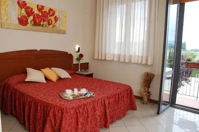 Letto o letti in una camera di Hotel Marzia