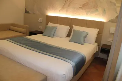 Letto o letti in una camera di Hotel Marzia