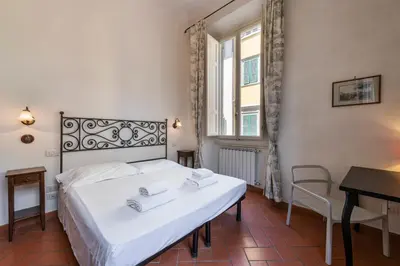 Letto o letti in una camera di Casa Ghibellina by Mmega
