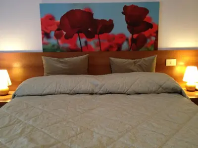 Letto o letti in una camera di Hotel Indicatore