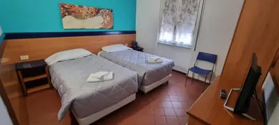 Letto o letti in una camera di Hotel Indicatore
