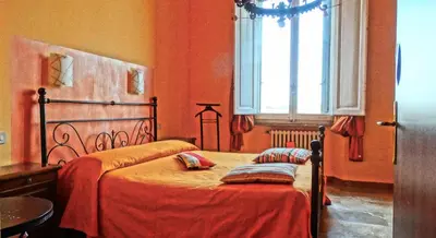 Letto o letti in una camera di Affittacamere Belfiore