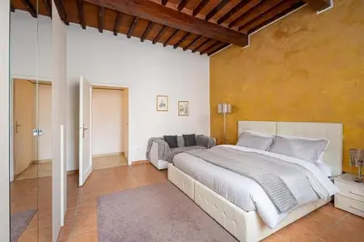 Letto o letti in una camera di Santa Rosa Apartment - Oltrarno