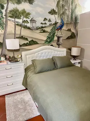 Letto o letti in una camera di Elegante bilocale / Elegant Double Room
