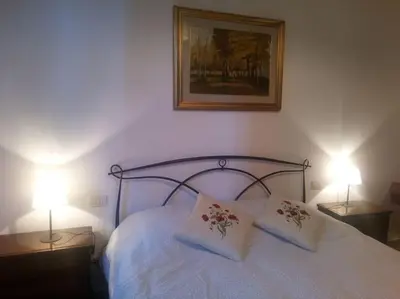 Letto o letti in una camera di Casa Gina - Welcome in Italy!