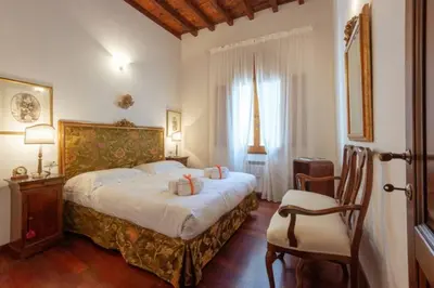 Letto o letti in una camera di Ponte Vecchio - Appartamento Oltrarno Ruby