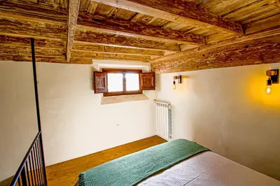 Letto o letti in una camera di Palazzo Leopardi