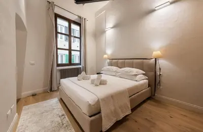 Letto o letti in una camera di Apartments Florence- The retreat