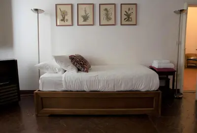 Letto o letti in una camera di Wine Apartments Florence Bolgheri